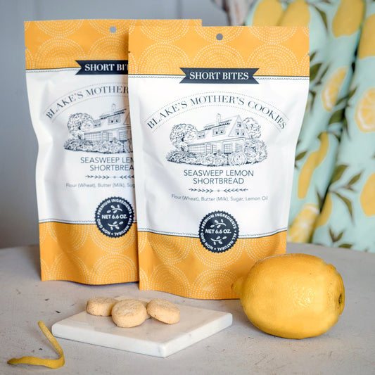Two 6.6 pouches of Seasweep Lemon Short Bites with a closeup of the bites and a lemon.