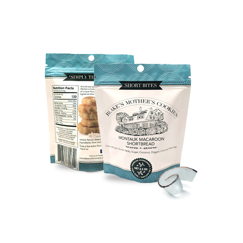 Two pouches of 2.2-oz. Blake's Mother's Cookies Short Bites with a coconut swirl in front