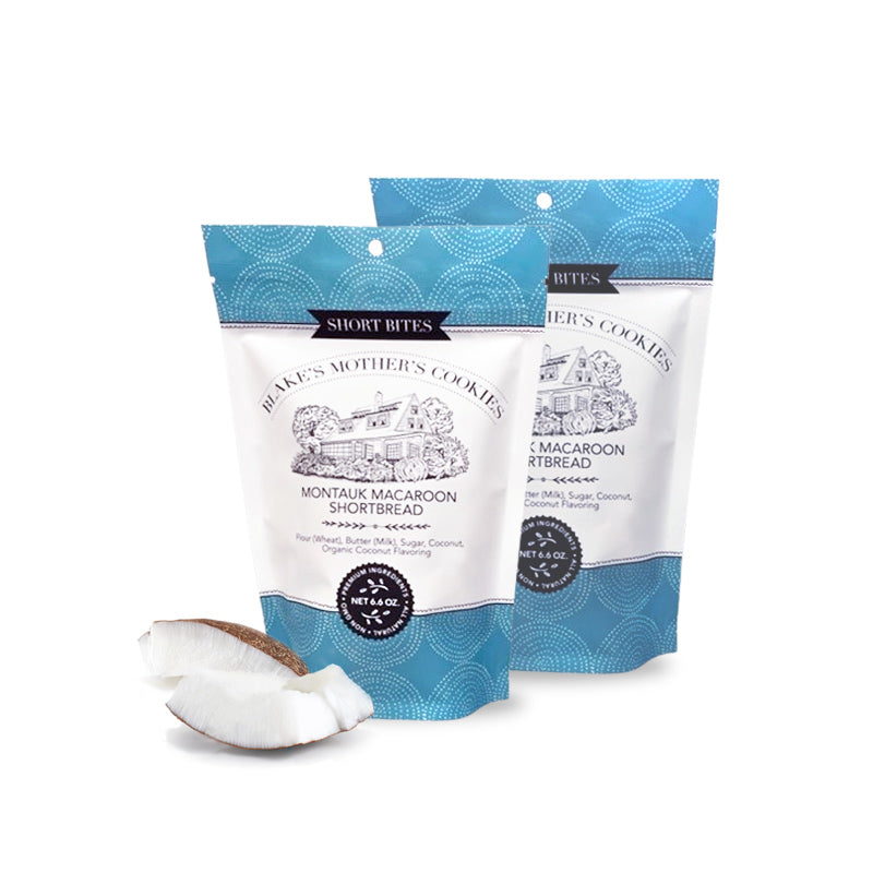 Two 6.6-oz. pouches of Blake's Mother's Cookies Montauk Macaroon Short Bites with slices of coconut
